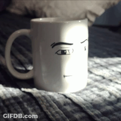 White Coffee Mug With Drawn Face GIF
