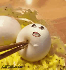 White Egg Face Picked Up By Chopsticks GIF
