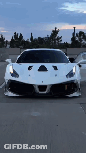 White Ferrari Parked In Lot GIF