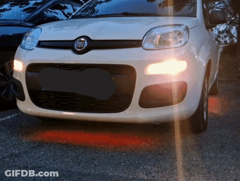 White Fiat Car Parked In Dark GIF