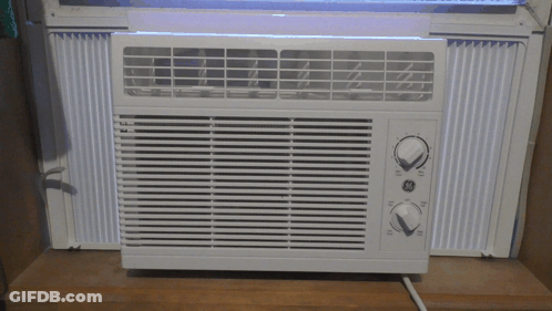 White GE Window Air Conditioner On Wooden Shelf GIF