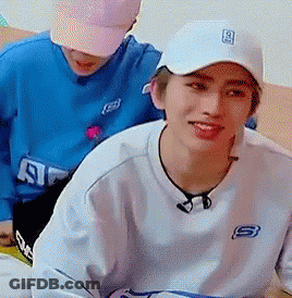 White Hat And Sweatshirt Man Beside Blue Shirt Man GIF