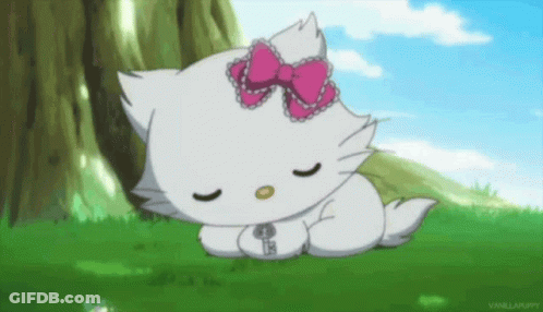 White Hello Kitty Sleeping In Grass With Pink Bow GIF