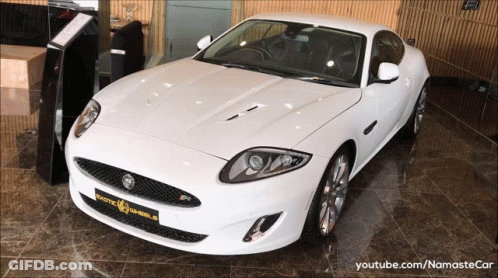 White Jaguar Sports Car In YouTube Video GIF