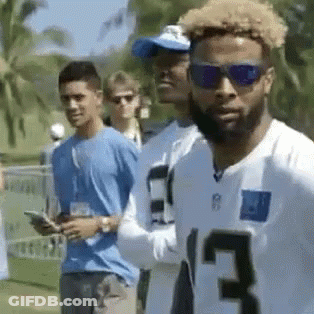 White Jersey 13 Sunglasses Man Next To Another GIF