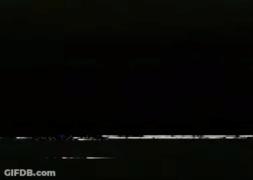 White Lightning Bolt Flying In Dark Room GIF