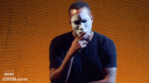 White Mask Man By Brick Wall With Bkbx GIF