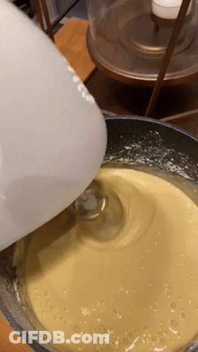 White Mixer Mixing Yellow Liquid GIF