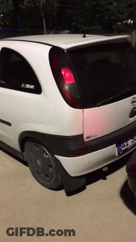White Opel Car With TC License Plate GIF