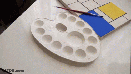 White Palette Next To Blue And Yellow Painting GIF