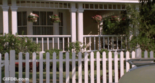 White Picket Fence In Front Of White House GIF