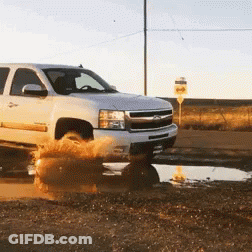 White Pickup Truck Driving Through Puddle GIF