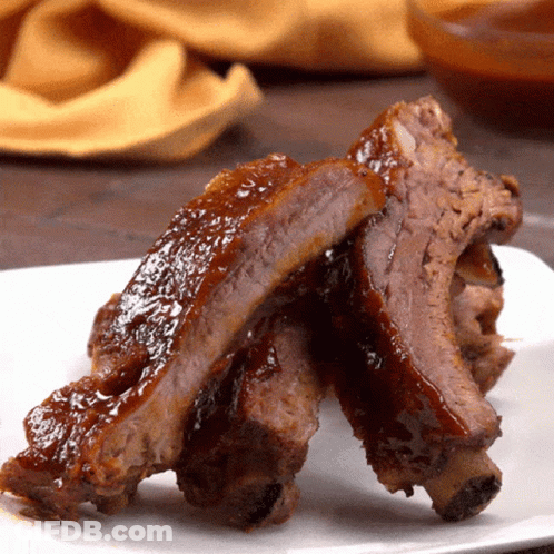 White Plate With Ribs And Sauce GIF