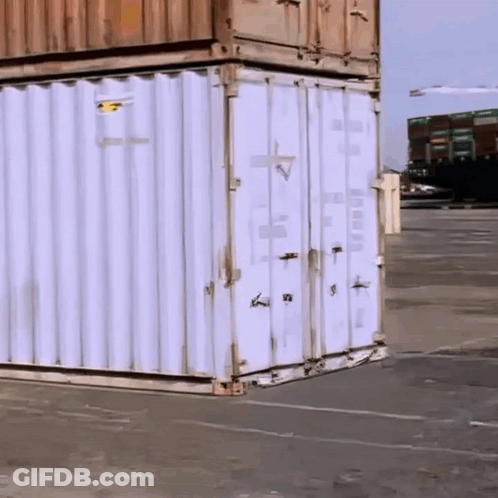 White Shipping Container With Yellow Sticker Saying A GIF
