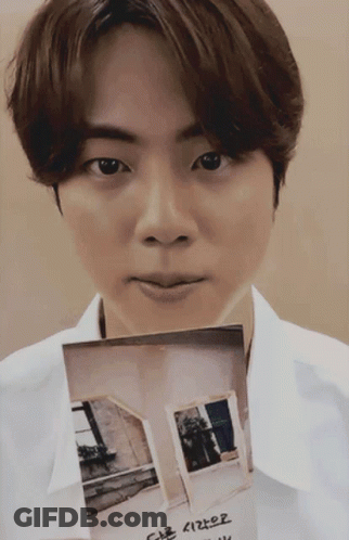 White Shirt Man Holding House Picture With Korean Writing GIF