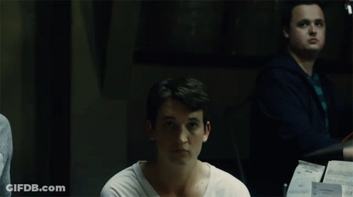 White Shirt Man Looking At Camera, Cello Player GIF
