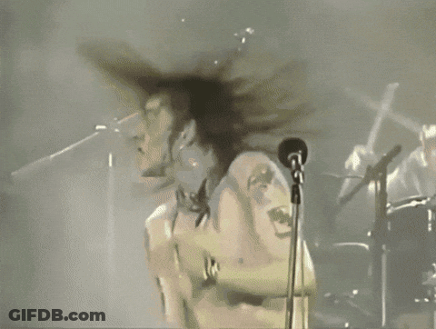 White Shirt Man Singing Into Microphone Arms Outstretched GIF
