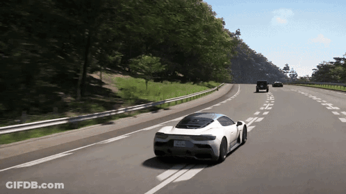 White Sports Car Driving Down Highway GIF