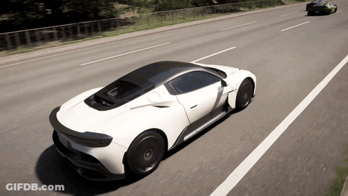 White Sports Car Driving Down Highway GIF