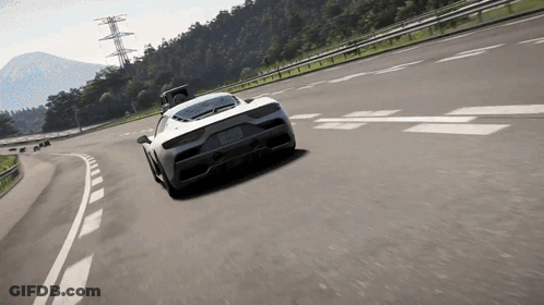 White Sports Car Driving Past Mountains GIF