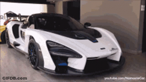 White Sports Car Next To Yellow Sports Car GIF
