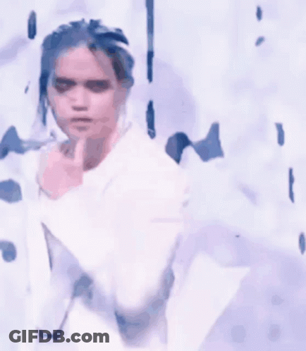 White Suit Woman Singing Into Microphone GIF