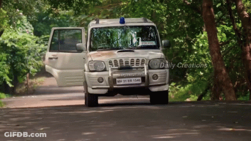 White SUV Driving Down Road Daily Creations GIF