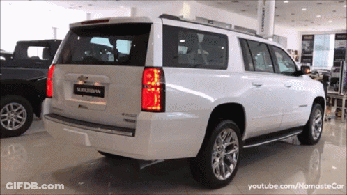 White SUV With Suburban On Back GIF