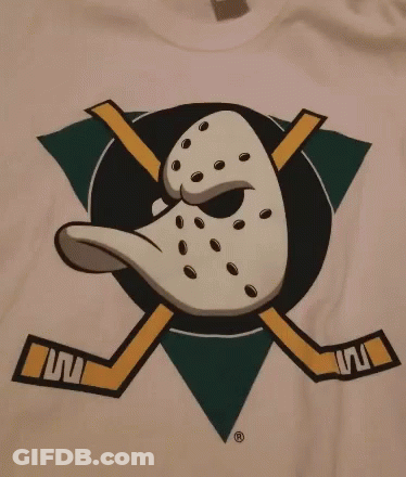 White T-Shirt With Duck And Crossed Hockey Sticks GIF
