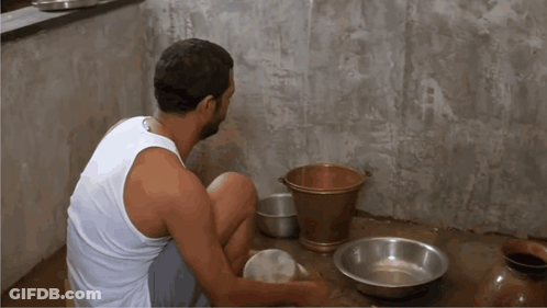 White Tank Top Man With Bowls And Bucket GIF