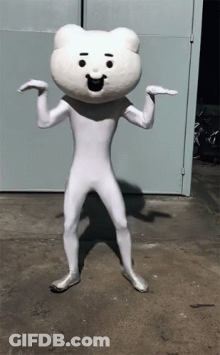 White Teddy Bear Mascot In Front Of Blue Door GIF