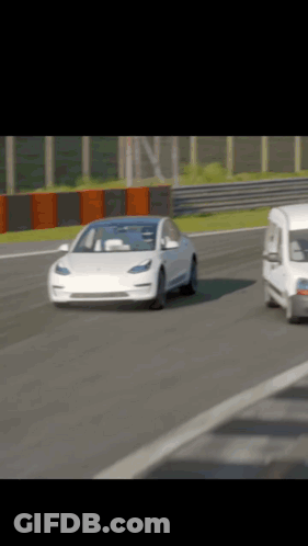 White Tesla Model 3 On Race Track With White Van GIF