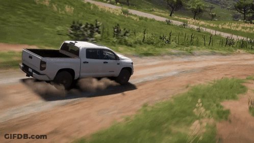 White Truck Driving Down Dirt Road GIF