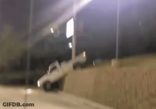 White Truck Driving Down Road At Night GIF