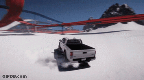 White Truck Driving Through Snow GIF