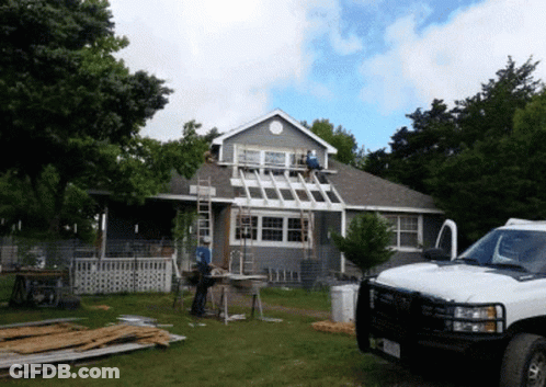 White Truck Parked In Front Of Remodeled House GIF