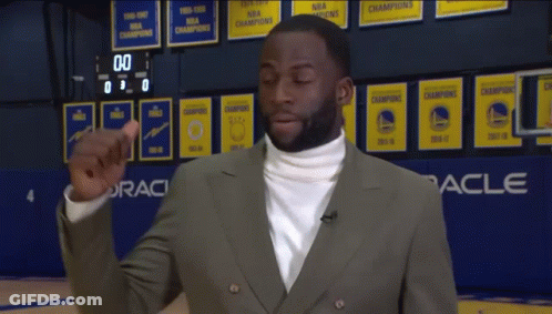 White Turtleneck Man By Oracle Sign On Basketball Court GIF