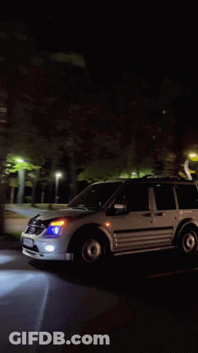 White Van Driving At Night With AA License Plate GIF