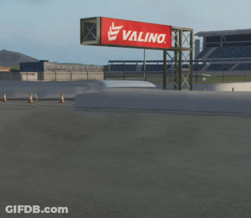 White Van Driving Past Valino Billboard GIF