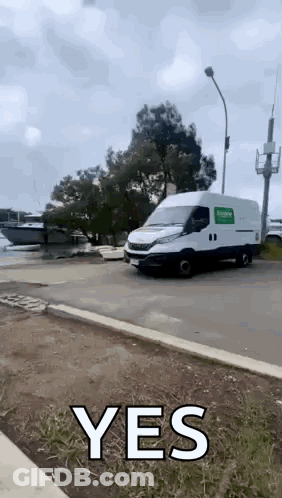 White Van Driving With Yes On Side GIF