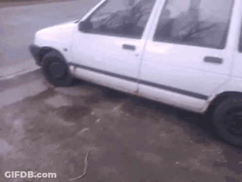 White Van Parked On Dirt Road GIF