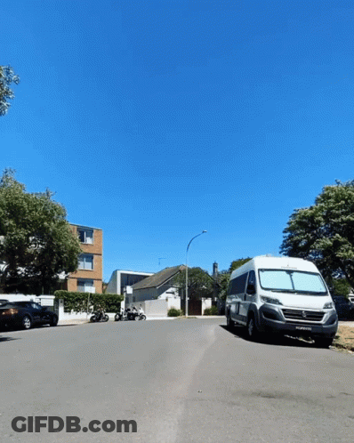 White Van Parked With ECW License Plate GIF