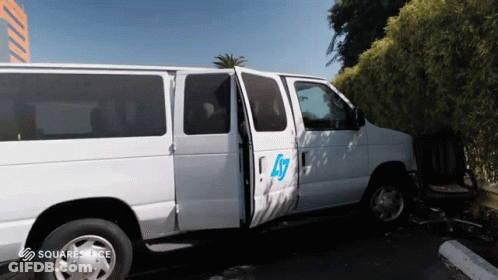 White Van With Number 47 Parked GIF