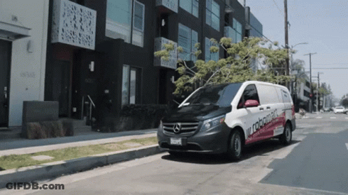 White Van With Robomatic Parked GIF