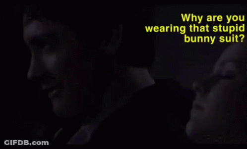 Why Are You Wearing That Stupid Man Suit Is Written In Yellow GIF