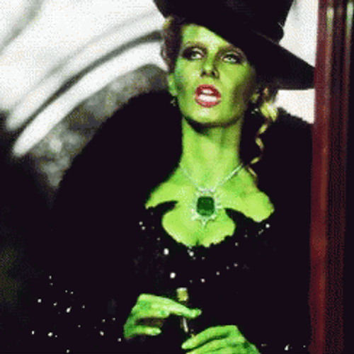 Wicked Witch Melting Selena With Big Jade Pendant GIF
