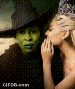 Wicked Witch Of The West Whispering In Woman's Ear GIF