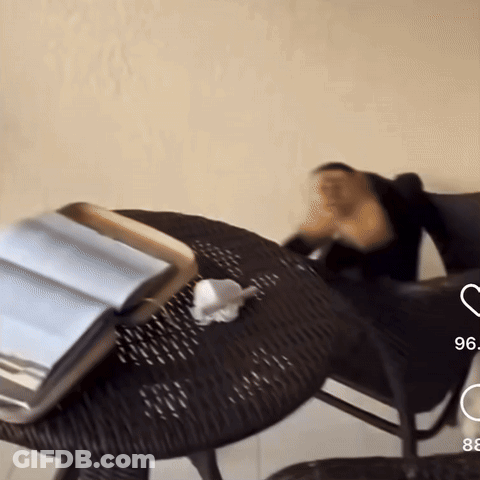 Wicker Table With Book And Number 96 GIF