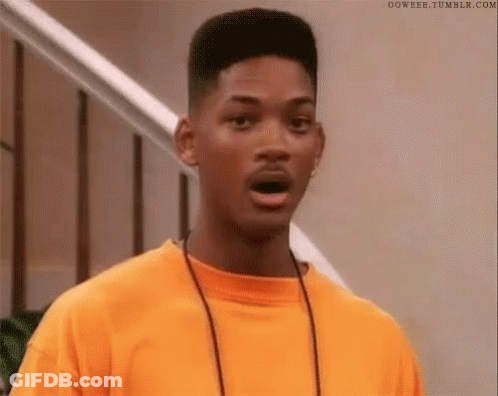 Will Smith Is Wearing An Orange T-Shirt And A Necklace And Making A Surprised Face . GIF