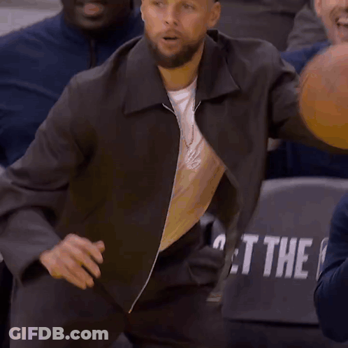 Wilson Basketball Held By Man In Crowd GIF